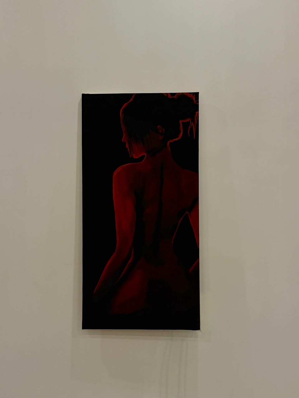 In Red, an acrylic figure painting displayed on a wall